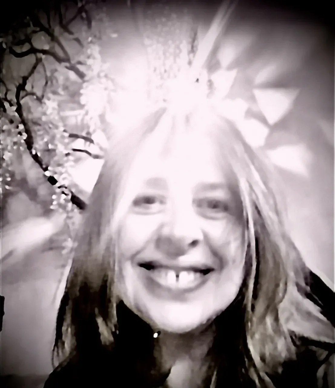 Smiling woman in a black-and-white portrait for a reflective archetype reading page Smiling woman in a black-and-white portrait for a reflective archetype reading page