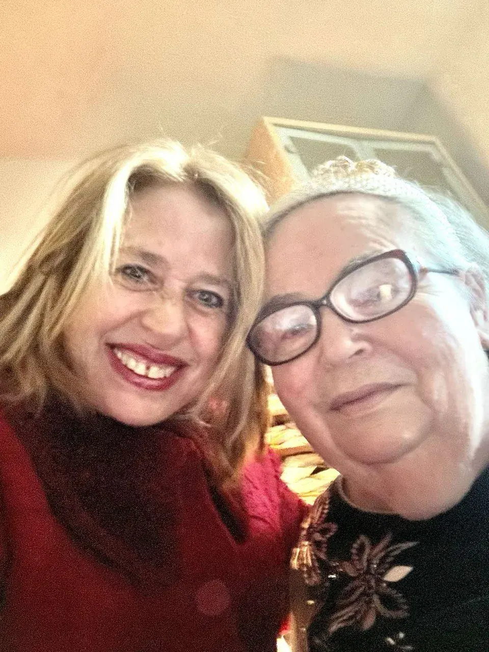 Two women smiling in an indoor selfie for personal vision coaching Two women smiling in an indoor selfie for personal vision coaching