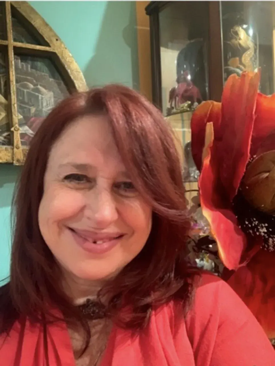 Smiling red-haired woman indoors for an angel prints spiritual wall art page Smiling red-haired woman indoors for an angel prints spiritual wall art page